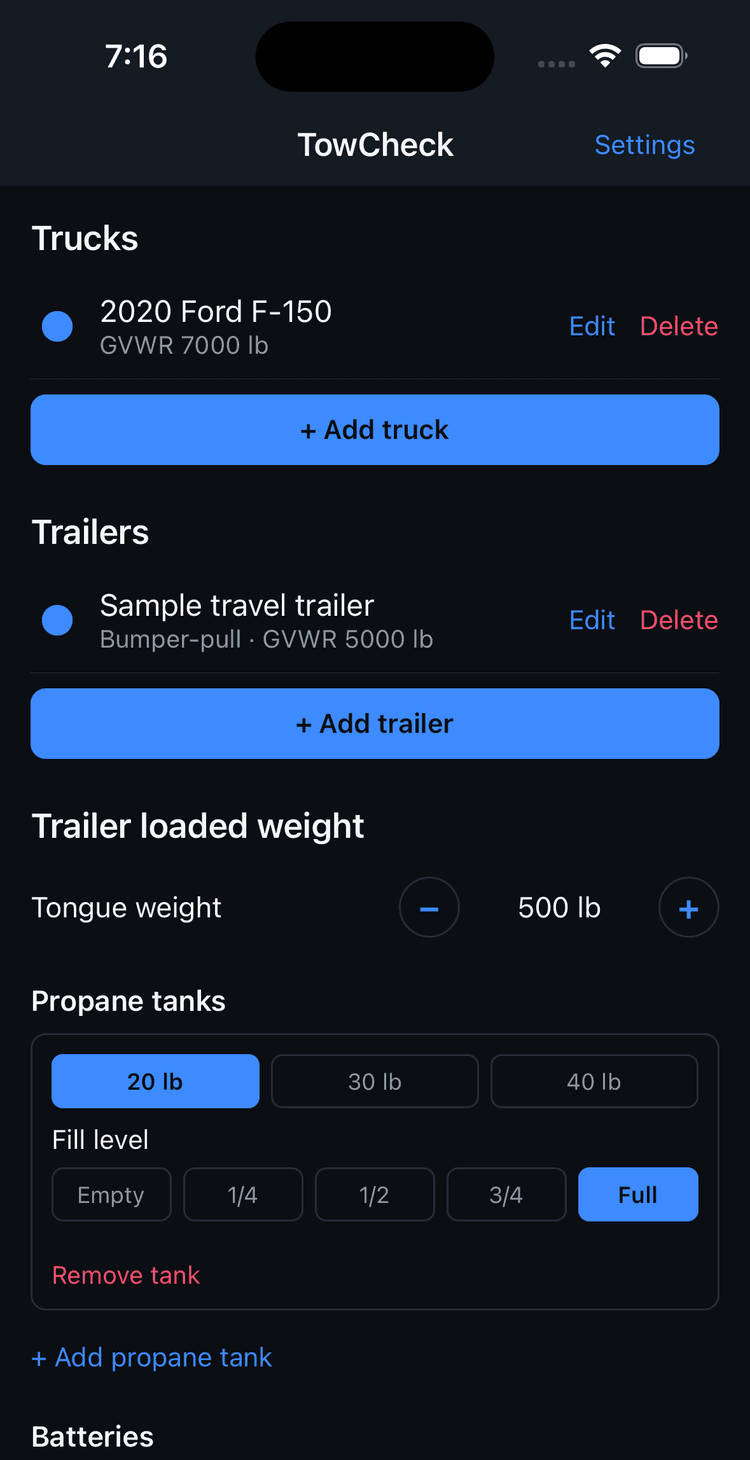 TowCheck setup screen showing saved truck and trailer profiles with GVWR